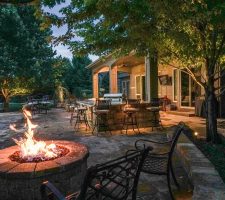 fire pit with metal furniture surrounding