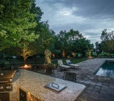 outdoor kitchen area overlooking new pool installation