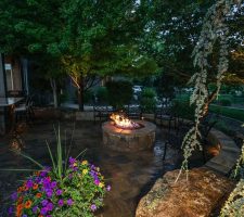 stone landscaping and design around fire pit